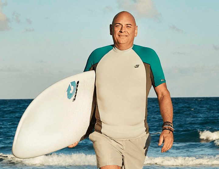Man holding surf board